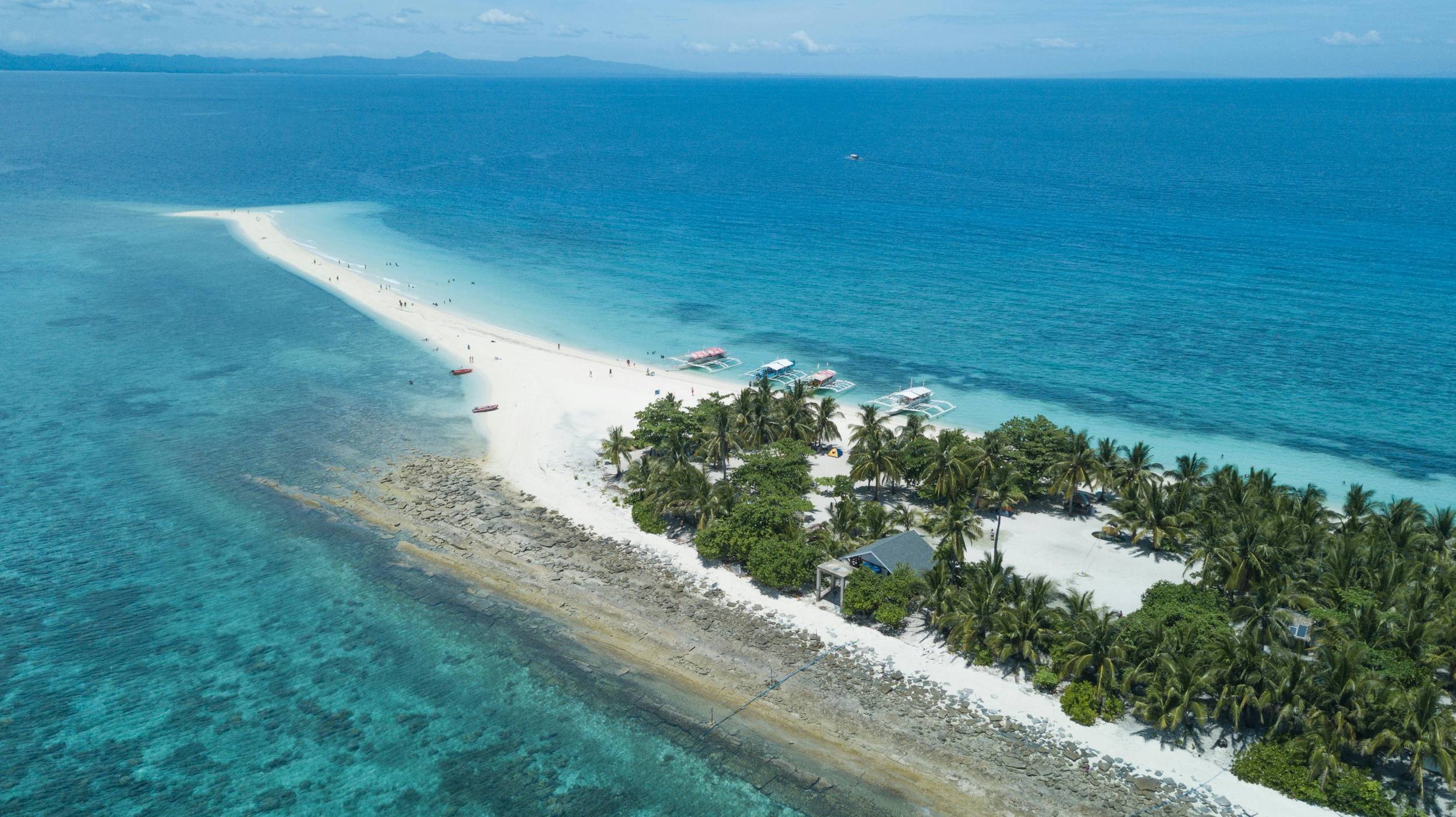 Sandbar in crystal-clear waters of Kalanggaman Island